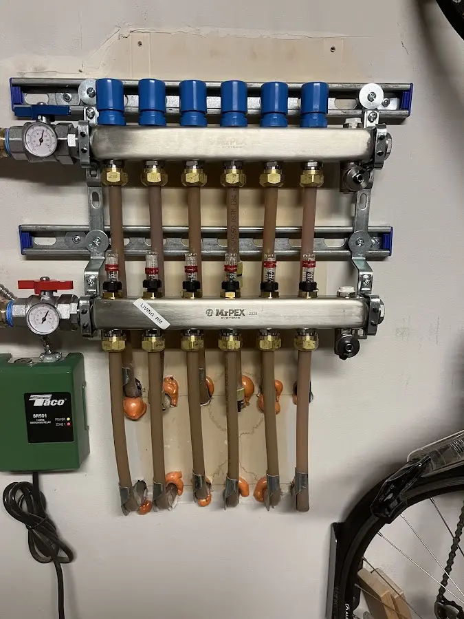 Plumber performing Water Heater Repair at a residential property in Ontwa